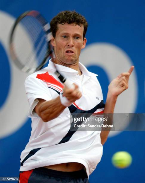 Lars Burgsmuller of Germany returns a shot to Juan Monaco of Argentina during the BMW Open tournament on April 26, 2005 in Munich, Germany.