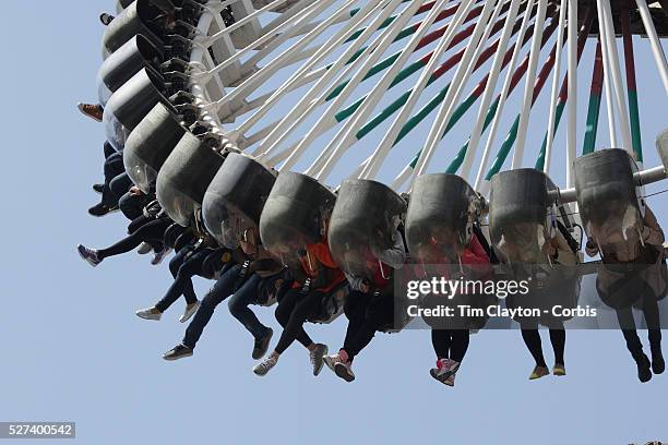 The Gyro Swing at the outdoor amusement park at Lotte World. Lotte World is the world's largest indoor theme park which includes shopping malls, a...