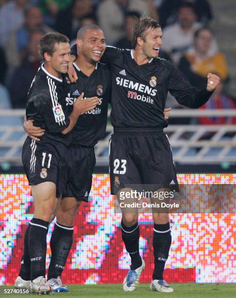 Real Madrid's Ronaldo celebrates scoring a goal with David Beckham and Michael Owen during a La Liga match between Real Sociedad and Real Madrid at...