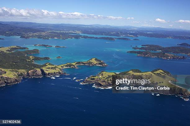 An aerial view of The Bay of Islands, North Island, New Zealand. The Bay of Islands boasts a unique coastline sheltering over 150 small islands in...