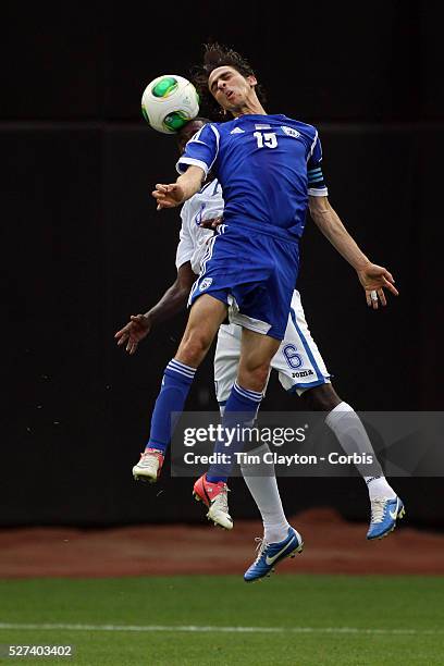 Benayoun Yossi Shai, Israel, and Juan C. Garcia, Honduras, challenge for a header during the Israel V Honduras International Friendly football match...