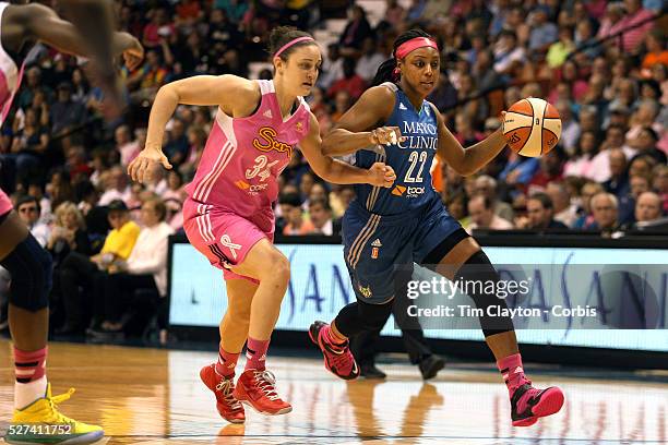 Monica Wright, , Minnesota Lynx, drives past Kelly Faris, Connecticut Sun, during the Connecticut Sun Vs Minnesota Lynx, WNBA regular season game at...