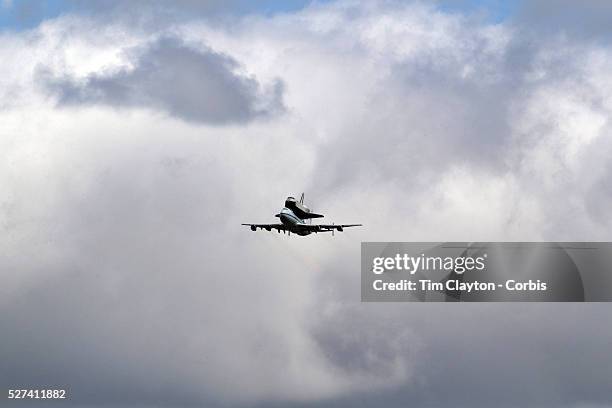 The NASA space shuttle Enterprise, riding on top of a modified jumbo jet, flying at low altitude past Manhattan during it's flypast of New York City....