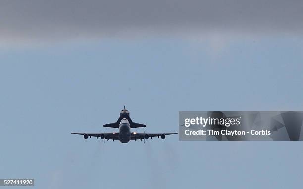 The NASA space shuttle Enterprise, riding on top of a modified jumbo jet, flying at low altitude past Manhattan during it's flypast of New York City....