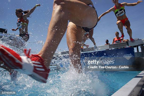 Competitors in action at the water jump in the Women's 3000m Steeplechase during the Diamond League Adidas Grand Prix at Icahn Stadium, Randall's...