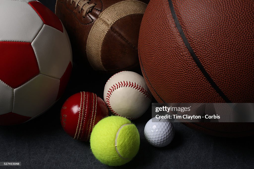 A studio shot of an assortment of sports ball.