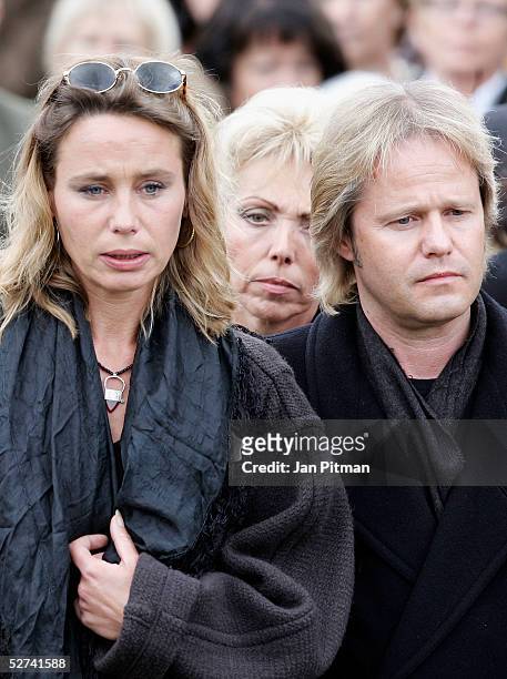 Maria Schell's son Oliver Schell, right, and her daughter Marie Theres Kroetz-Relin, left, attend the funeral of actress Maria Schell at the Nikolaus...