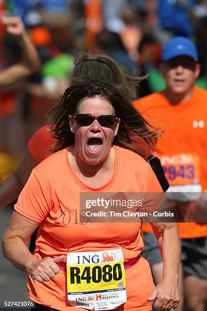 The Finish Line. Expressions of agony and ecstasy on the faces of athletes as they complete the ING Hartford Marathon, Bushnell Park, Hartford....