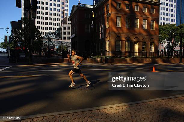 Runners head through there city centre in early morning light as they complete the ING Hartford Marathon, Bushnell Park, Hartford. Connecticut. USA....