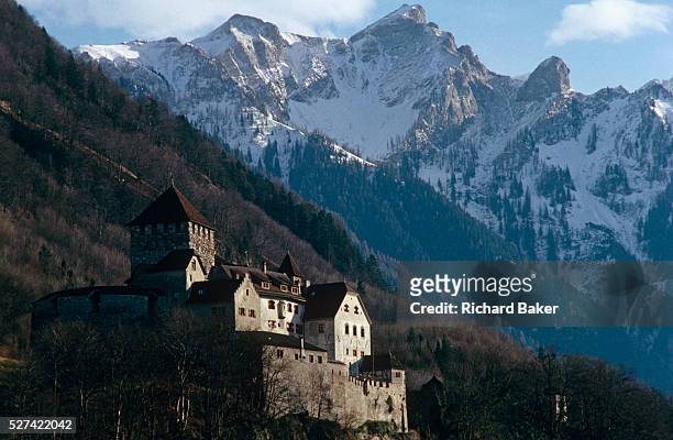 Schloss Vaduz perches high on the slopes above Vaduz, the capital of the tiny landlocked Principality of Liechtenstein. Prince Hans-Adam II is the...