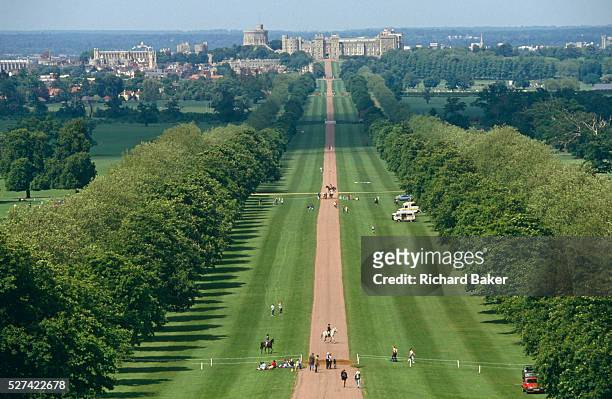 From a high viewpoint on Snow Hill, we see the green 'Long Walk' in the Royal Estate's Windsor Great Park. We look down the 3-mile straight road into...