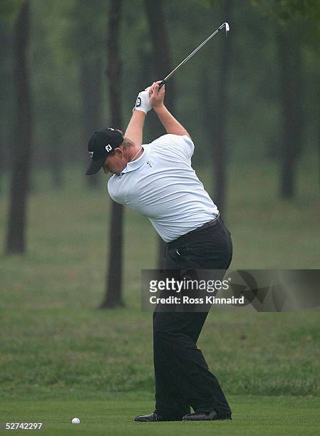 Ernie Els of South Africa plays his second shot on the par four 6th during the final round of the BMW Asian Open at the Tomson Golf Club on May 1,...