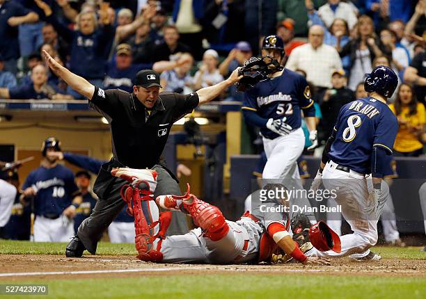 Home plate umpire Clint Fagan calls Ryan Braun of the Milwaukee Brewers safe after a tag attempt by Geovany Soto of the Los Angeles Angels of Anaheim...