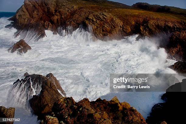 The full force of the Atlantic with 11 meter wave hitting the 100ft cliffs behind West Town. Tory Island - nine miles off the Donegal coast,...