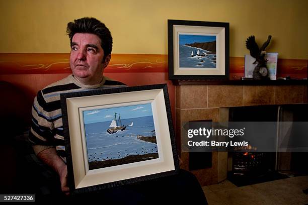 Ruiri Rogers hoding one of his paintings. Encouraged by Derek Hill, Ruiri is one of the islanders who began to paint in the early 1960's. Knowing...