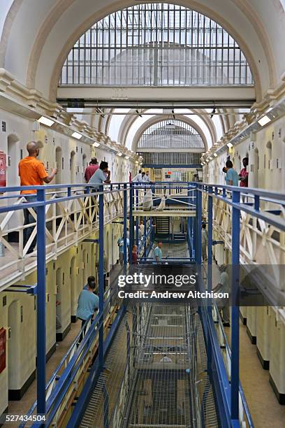 Prisoners socialise outside their cells on the balconies of A wing at Wandsworth prison. HMP Wandsworth in South West London was built in 1851 and is...