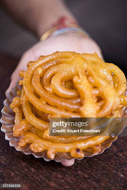 Fresh jalebi at the Old and Famous Jalebi Wala . Delhi, India