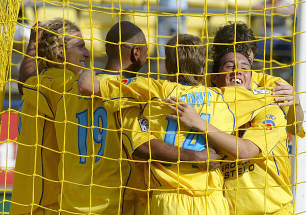 Villarreal's Uruguayan Diego Forlan celebrates his second goal against Getafe's with teammates Brazilian Marcos Sena , Hector Font , Santi Cazorla ,...
