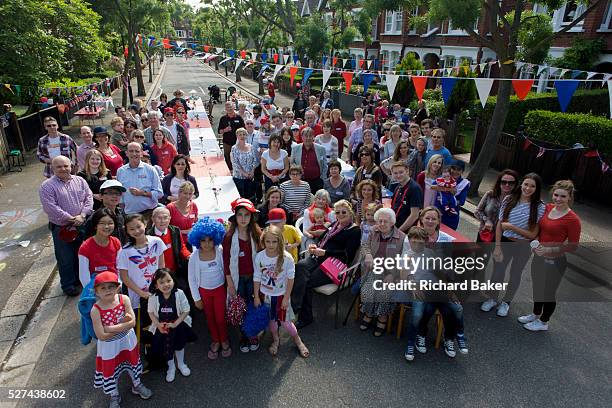 Group portrait of a neighbourhood street party in Dulwich, south London celebrating the Diamond Jubilee of Queen Elizabeth. A few months before the...