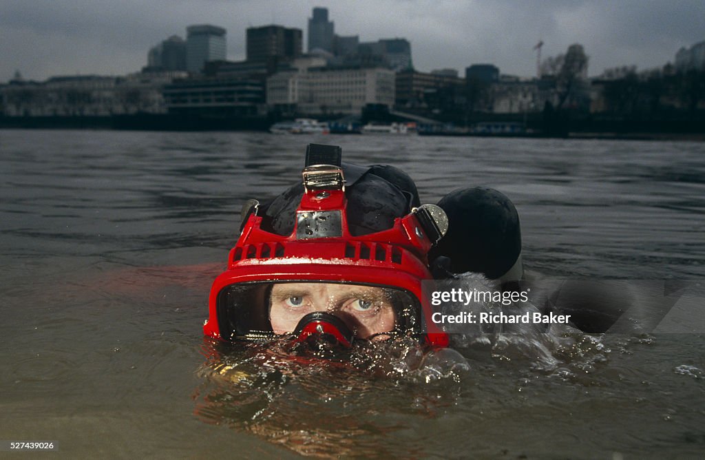 England - London - City of London Police diver surfaces in River Thames