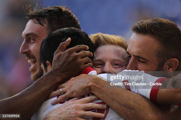 Tim Cahill, New York Red Bulls, is congratulated after scoring by team mates Eric Alexander, , Dax McCarty and Brandon Barklage, , during the New...