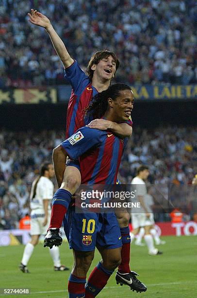 Barcelona's Argentinian Messi and Brazilian Ronaldinho celebrate their second goal against Albacete during their Spanish League football match at the...
