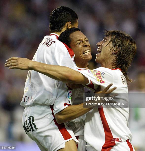 Sevilla's Adriano , Sergio Ramos and Jesus Navas celebrate scoring against Deportivo Coruna during their Spanish League match at Sanchez Pizjuan...