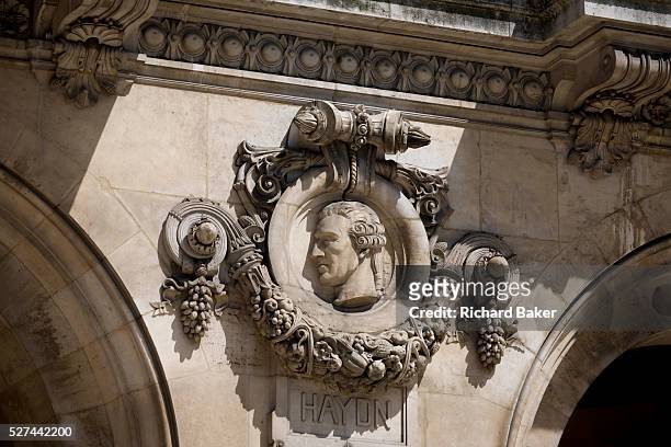 German composer Joseph Haydn on the exterior of the Opera Garnier Paris, France. The Palais Garnier is a 1,979-seat opera house, which was built from...