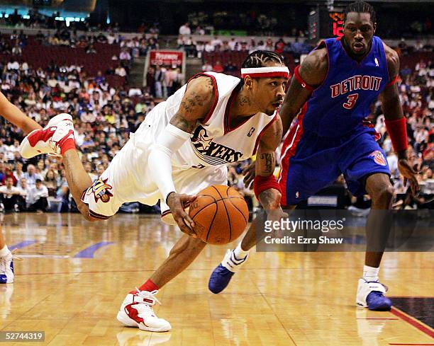 Allen Iverson of the Philadelphia 76ers dribbles around Ben Wallace of the Detroit Pistons during game four of the Eastern Conference Quarterfinals...