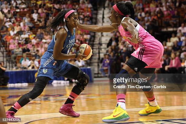 Devereaux Peters, , Minnesota Lynx, receives some in your face defense from Chiney Ogwumike, Connecticut Sun, during the Connecticut Sun Vs Minnesota...