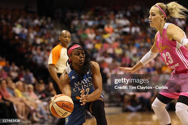 Monica Wright, , Minnesota Lynx, prepares to pass while defend by Katie Douglas, Connecticut Sun, during the Connecticut Sun Vs Minnesota Lynx, WNBA...