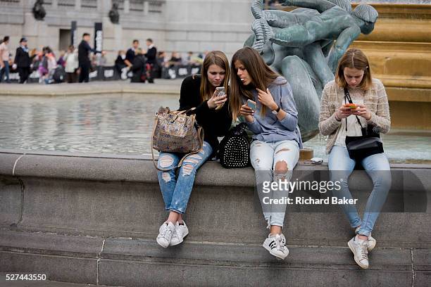 Three teenage girls are lost in the world of smartphone apps and messaging, in Trafalgar Square. While in a very busy environment, the capital's main...