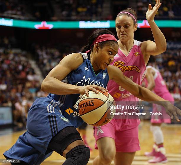 Maya Moore, Minnesota Lynx, drives to the basket defended by Kelly Faris, Connecticut Sun, during the Connecticut Sun Vs Minnesota Lynx, WNBA regular...