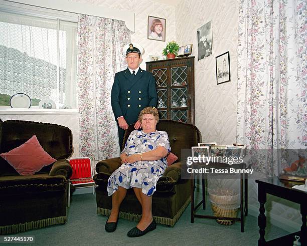 Portrait of a lighthouse keeper and his wife at home, Bull Point Lighthouse, North Devon, UK. There were no women lighthouse keepers except those...