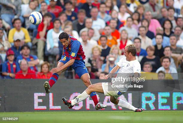 Juliano Belletti of FC Barcelona and Jaime of Albacete in action during the La Liga match between FC Barcelona and Albacete on May 1, 2005 at Nou...