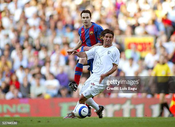 Andres Iniesta of FC Barcelona and Antonio Pacheco of Albacete in action during the La Liga match between FC Barcelona and Albacete on May 1, 2005 at...