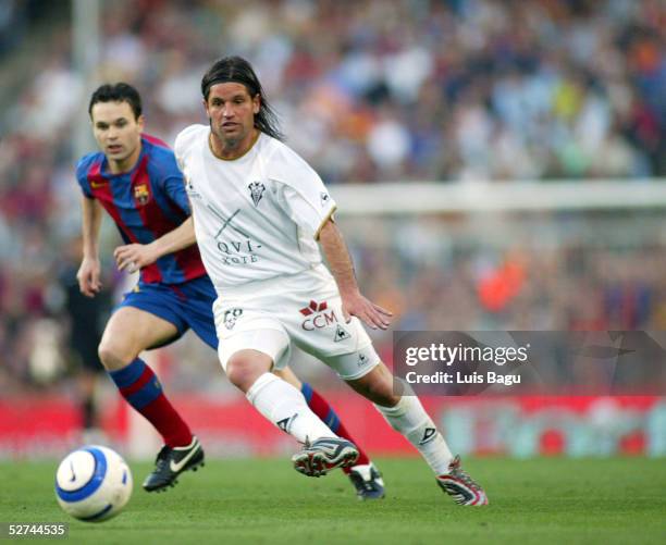 Antonio Pacheco of Albacete and Andres Iniesta of FC Barcelona in action during the La Liga match between FC Barcelona and Albacete on May 1, 2005 at...