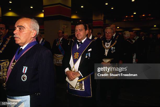 London - Assembled Freemasons prepare to process into Earls Court, London. Freemasonry, which traces it's modern origins back to the sixteenth...