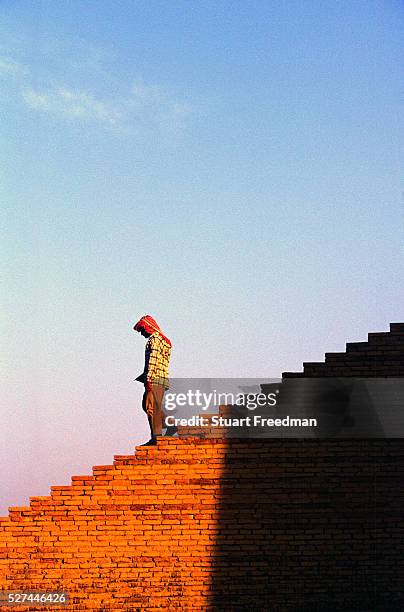 Man walks down the ziggurat at Ur, supoosedly the city of the prophet Abraham's birth. Ur was a principal city of ancient Mesopotamia. The Ziggurat...