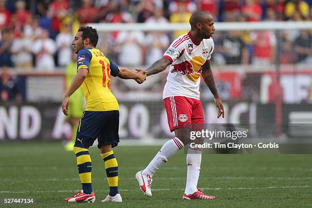 Santi Cazorla, , Arsenal, shakes hands with Thierry Henry, New York Red Bulls, as he is substituted during the New York Red Bulls Vs Arsenal FC,...
