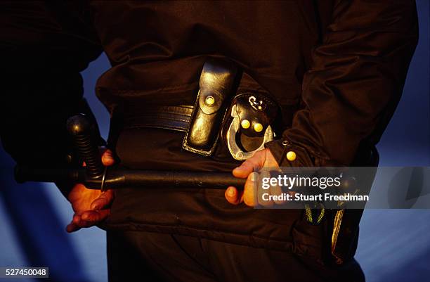 Riot policeman with truncheon