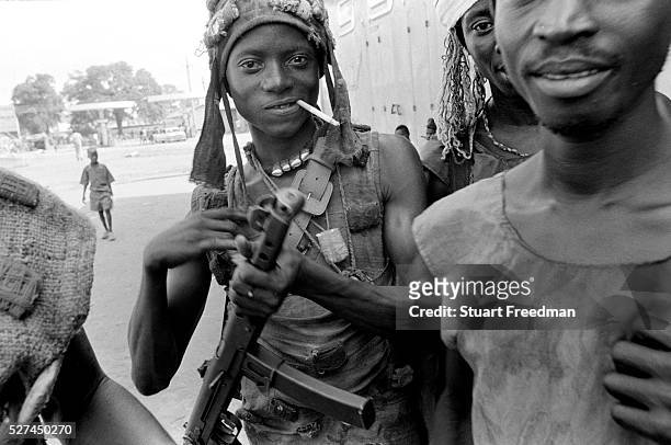 Kamajor Fighters in Bo, Sierra Leone. Kamajors were a well armed militia fighting for the government forces aginst the RUF rebels. Linked with...