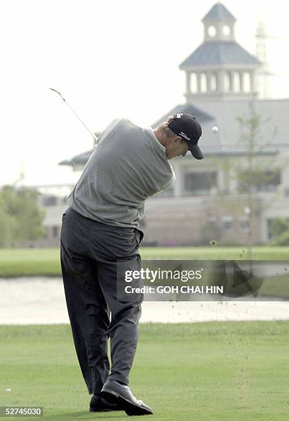 World number three Ernie Els takes his second shot from the 15th fairway during the final round of the 1.5 million dollar BMW Asian Open in Shanghai...