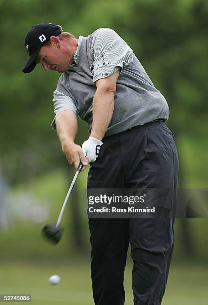Ernie Els of South Africa plays his second shot on the par five 13th hole during the delayed final round of the BMW Asian Open at the Tomson Golf...