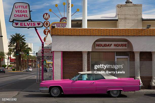 Pink Car outside Las Vegas wedding chapel with Elvis sign,