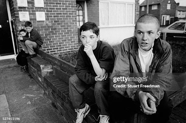 Two boys while away their day on the Northwood Estate Kirkby, Merseyside a notoriously run down inner city area where crime and unemployment are high...
