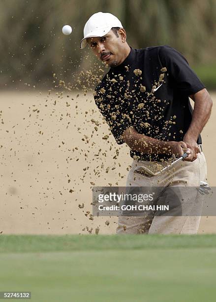 India's Jeev Milkha Singh blasts his shot out from a sand trap during the final round of the 1.5 million USD BMW Asian Open in Shanghai, 02 May 2005....