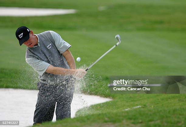 Ernie Els of South Africa hits a shot at the 13th hole during the final round of the BMW Asian Open at the Tomson Golf Club on May 2, 2005 in...