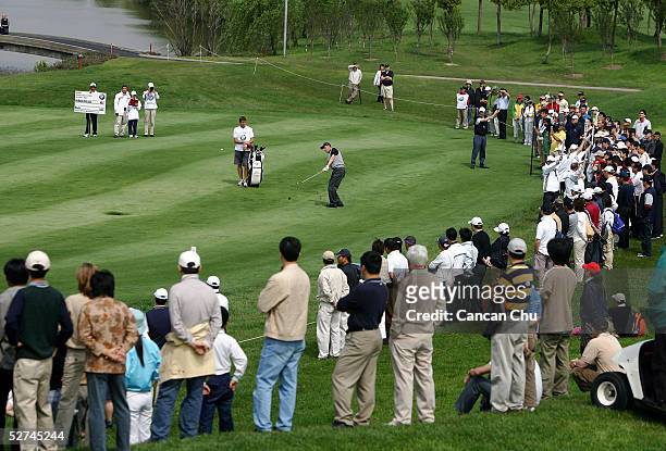Simon Wakefield of England hits a shot at the 18th hole during the final round of the BMW Asian Open at the Tomson Golf Club on May 2, 2005 in...