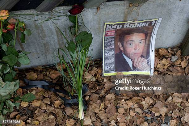 Picture of Austrian politician Joerg Haider at a shrine set up by his supporters after he was killed in a car accident at the spot in the village of...